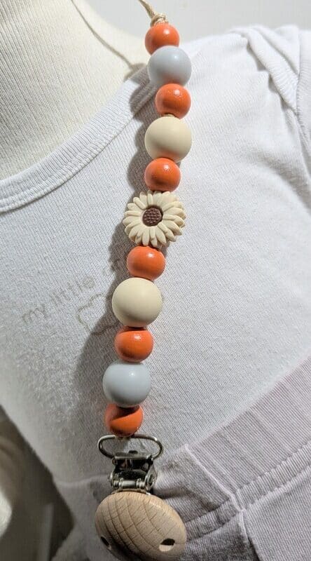 Attache tétine, orange & fleur