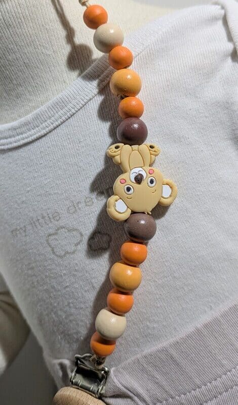 Attache tétine, orangé